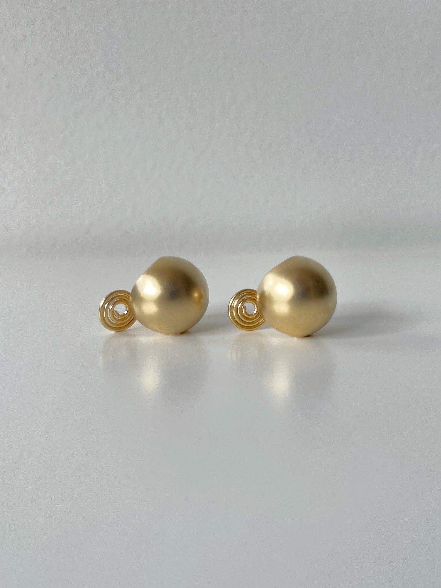 Golden Matte Ball Hoop Clip On Earrings. gold-tone clip-on earrings for women.