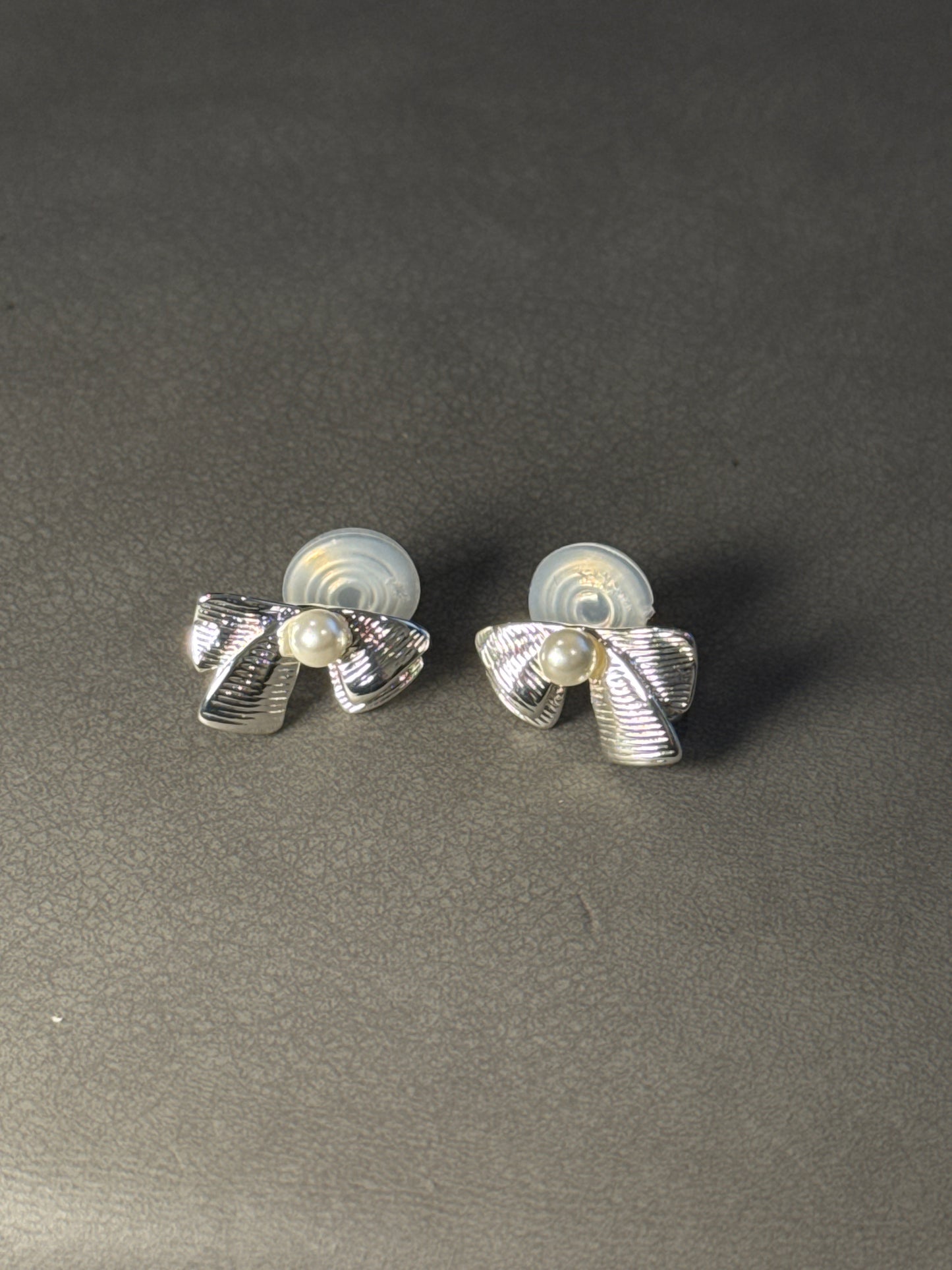 Silver Metal Textured Bow Pearlised Clip On Earrings
