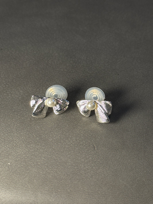Silver Metal Textured Bow Pearlised Clip On Earrings