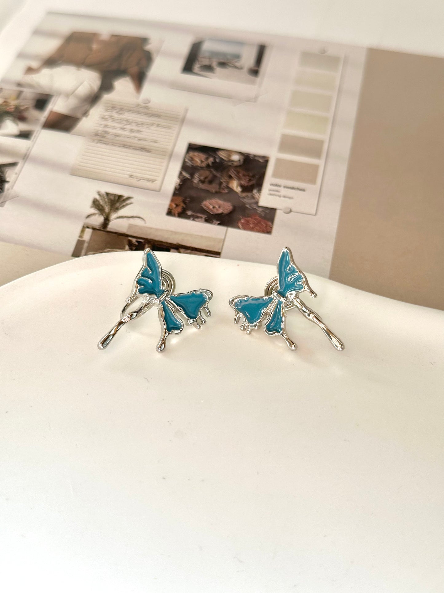 Silver and Blue Butterfly Clip On Earrings. silver-tone clip-on earrings for women.