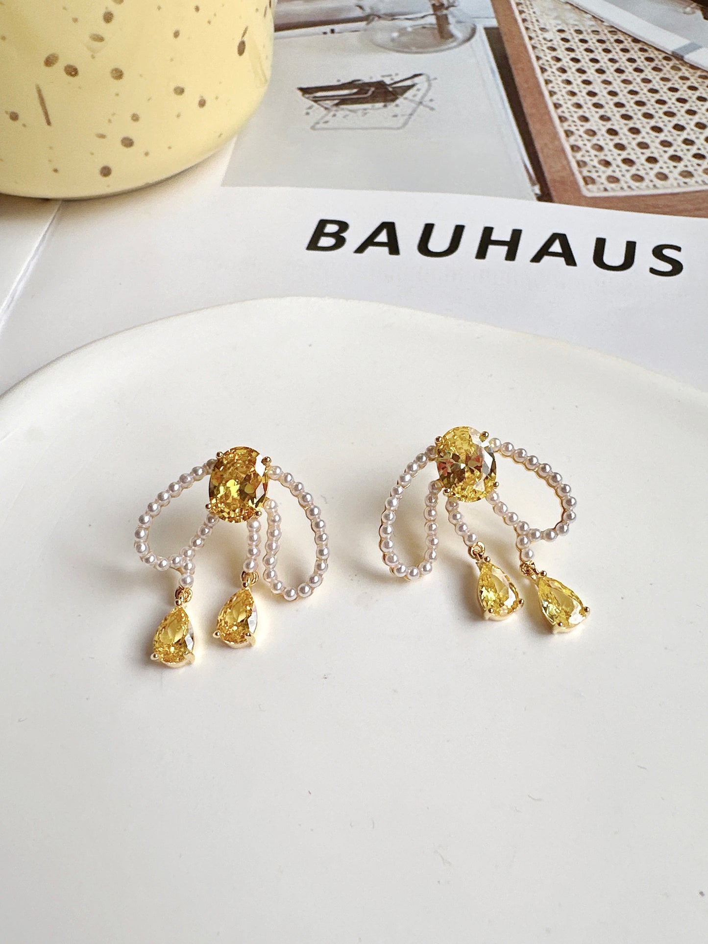 Pearlised Bow with Yellow Zircon Stud Earrings