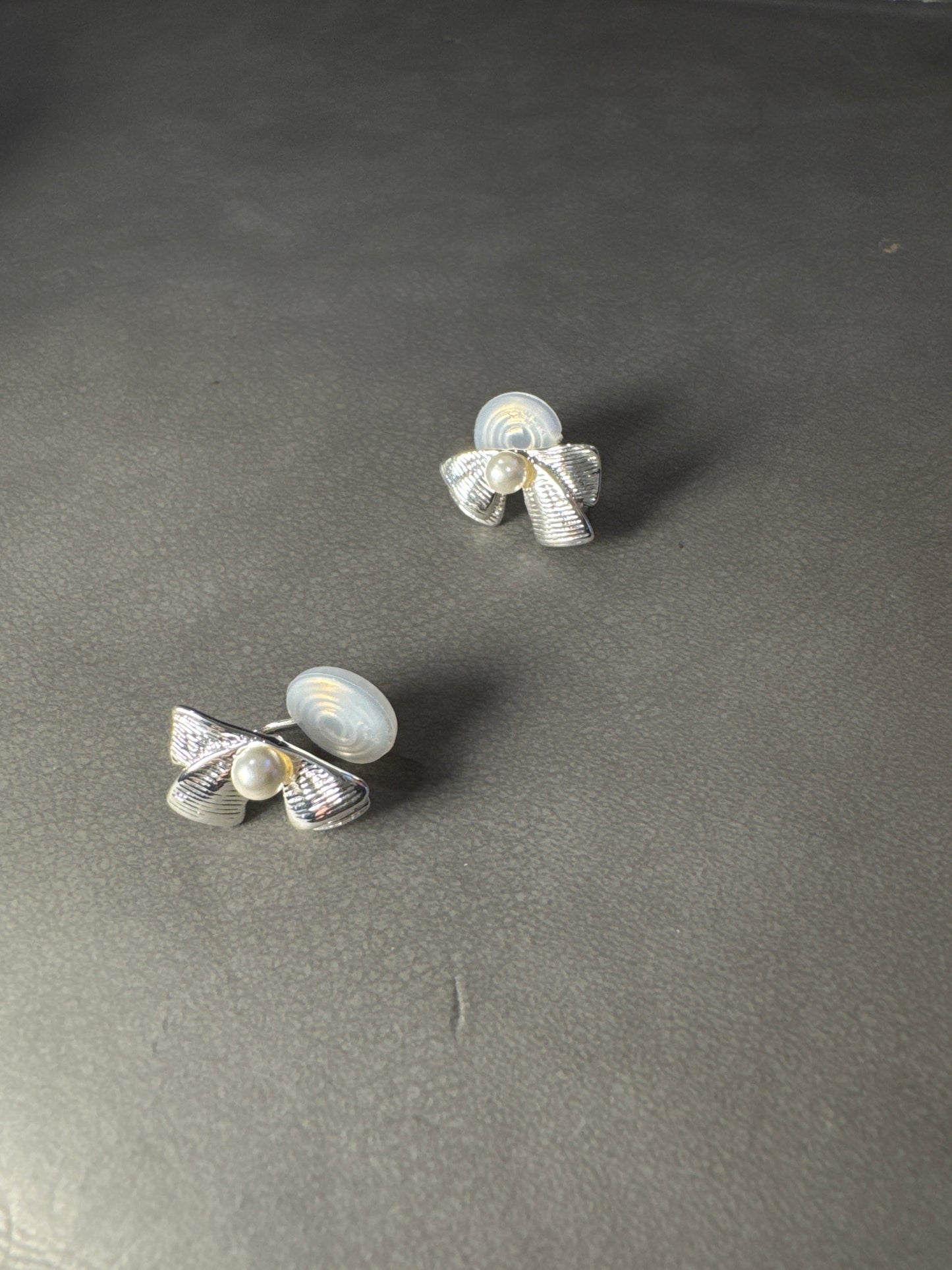 Silver Metal Textured Bow Pearlised Clip On Earrings