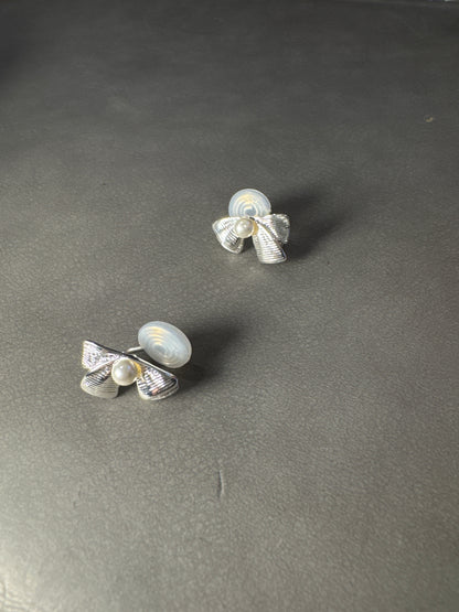 Silver Metal Textured Bow Pearlised Clip On Earrings