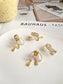 Pearlised Bow with Yellow Zircon Clip On Earrings