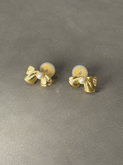 Golden Metal Textured Bow Pearlised Clip On Earrings