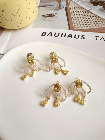 Pearlised Bow with Yellow Zircon Clip On Earrings