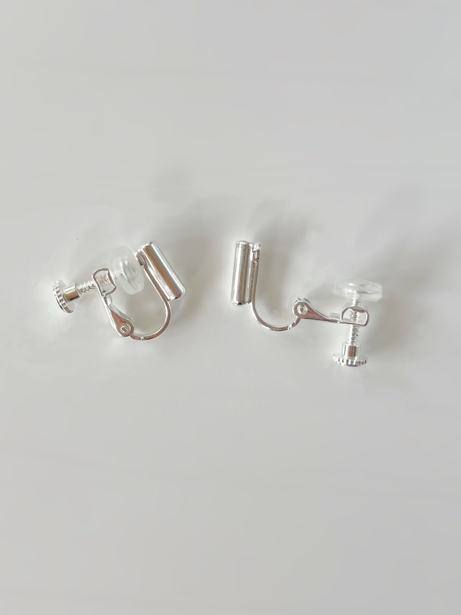 Silver Clip On With Silicon Earrings Converters. silver-tone clip-on earrings for women.