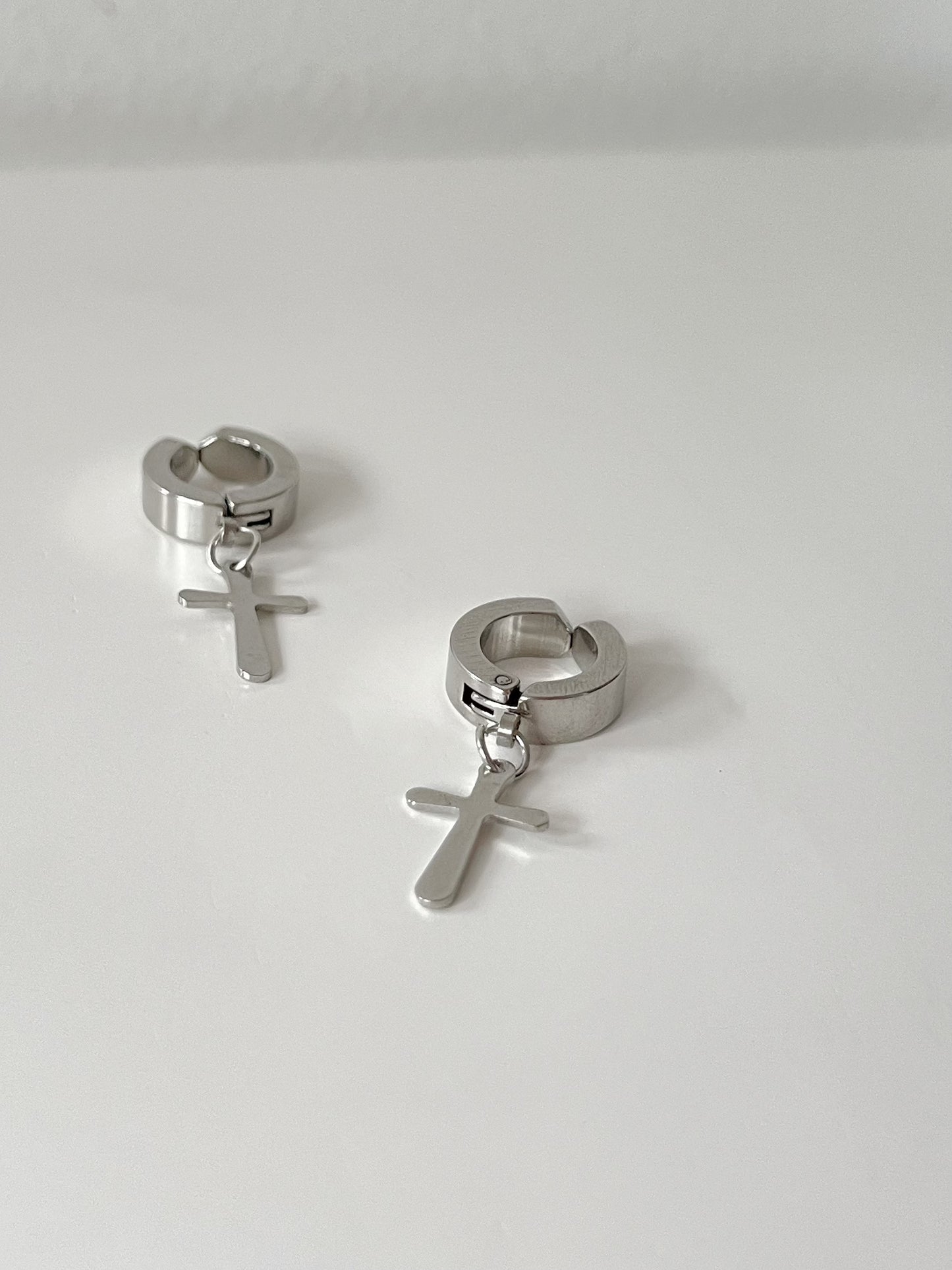 Men's Stainless Steel Silver Cross Clip On Hoop Earrings. silver-tone clip-on earrings for women.