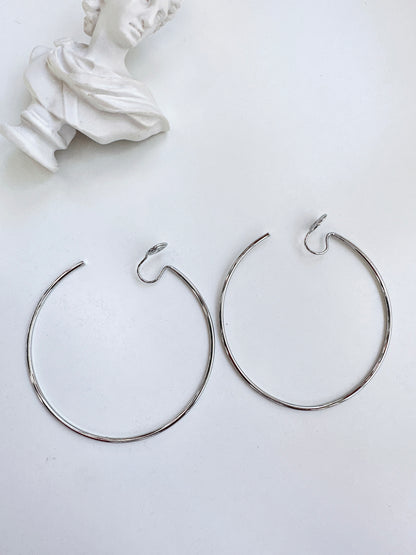 Silver Large Thin Hoop Clip On Earrings. silver-tone clip-on earrings for women.