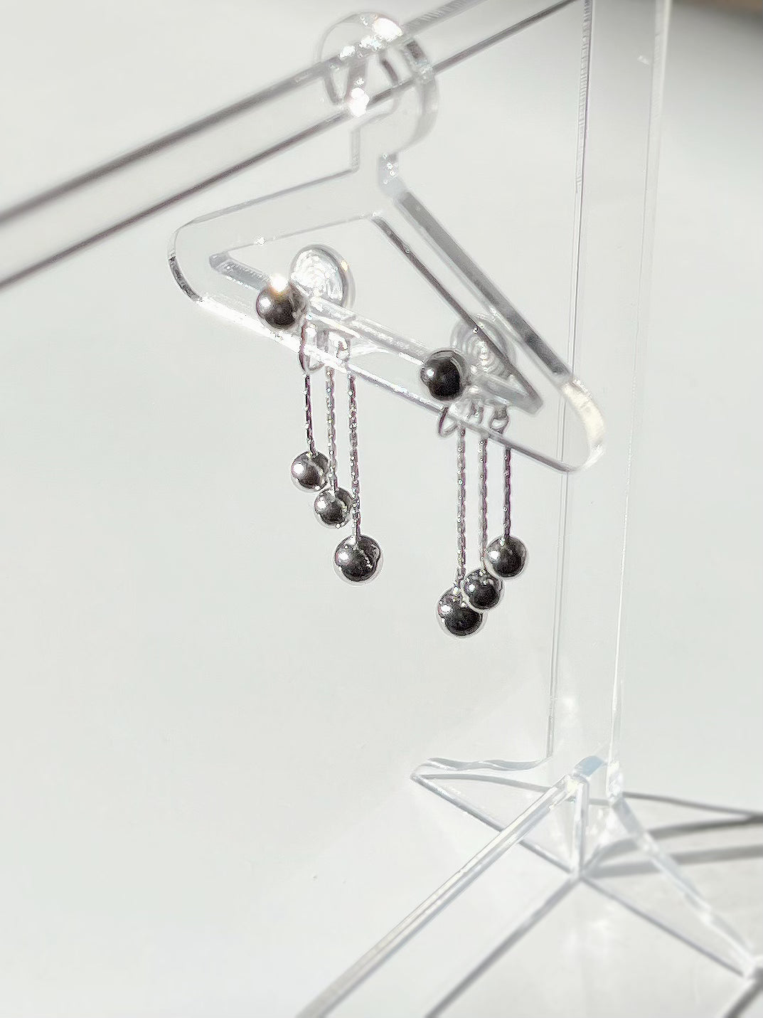 Silver Tassel Ball Pendant Clip On Earrings. silver-tone clip-on earrings for women.