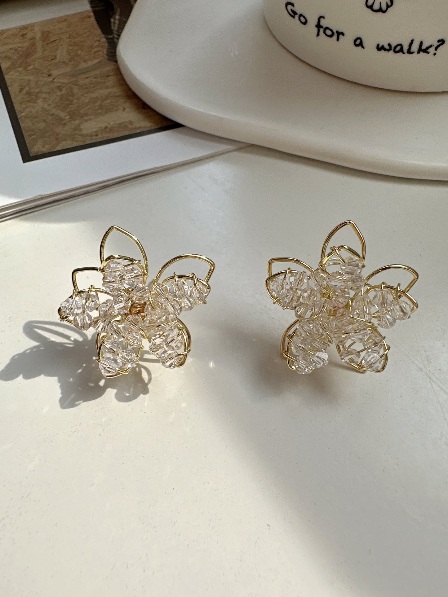 Golden Beaded Flower Stud Earrings. gold-tone clip-on earrings for women.