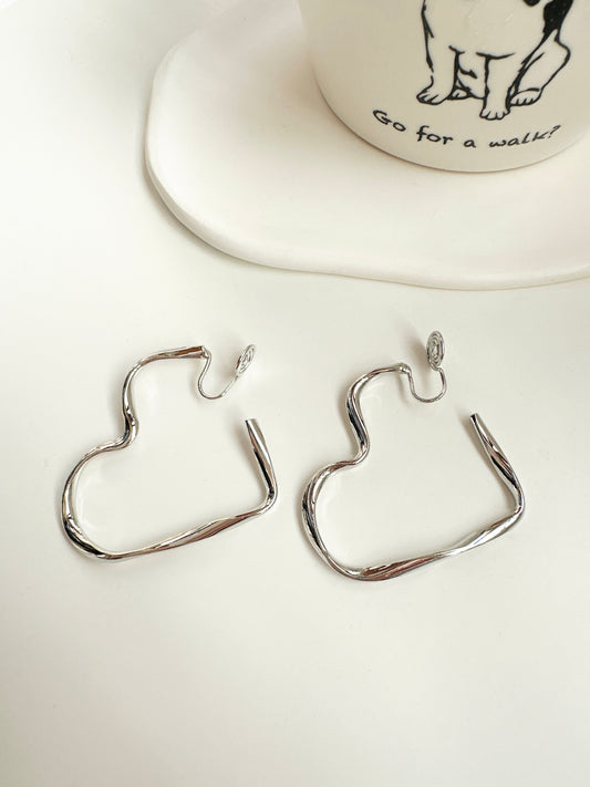 Silver Large Open Heart Hoop Clip On Earrings. silver-tone clip-on earrings for women.