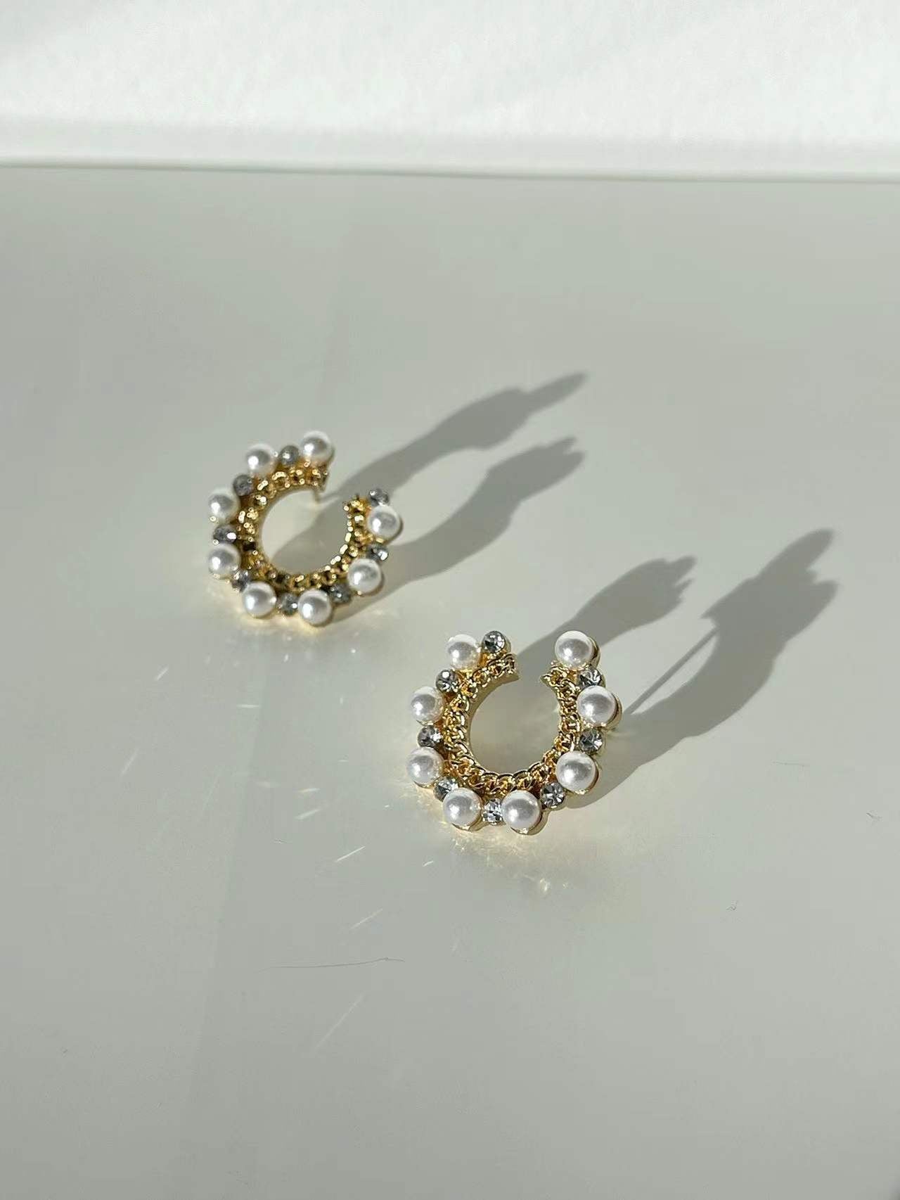 Golden Pearlised C Curve Diamante Stud Earrings