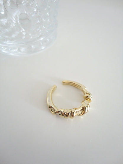 Golden Twist Textured Ring. gold-tone clip-on earrings for women.