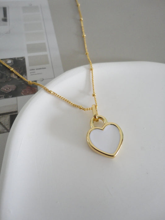 Black and White Double-Side Golden Heart Necklace. gold-tone clip-on earrings for women.