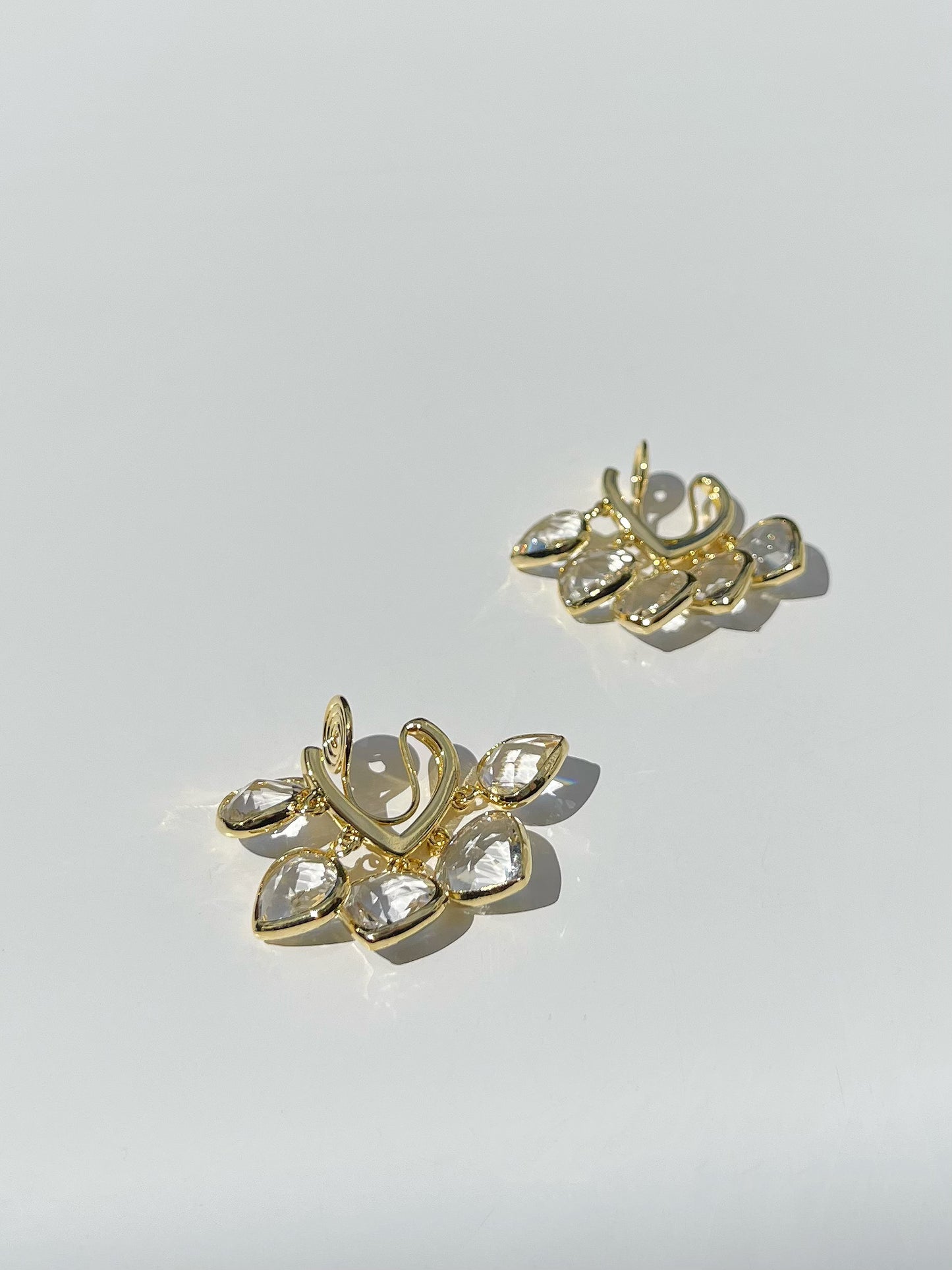 Golden Crystal Hearts Clip On Earrings. gold-tone clip-on earrings for women.