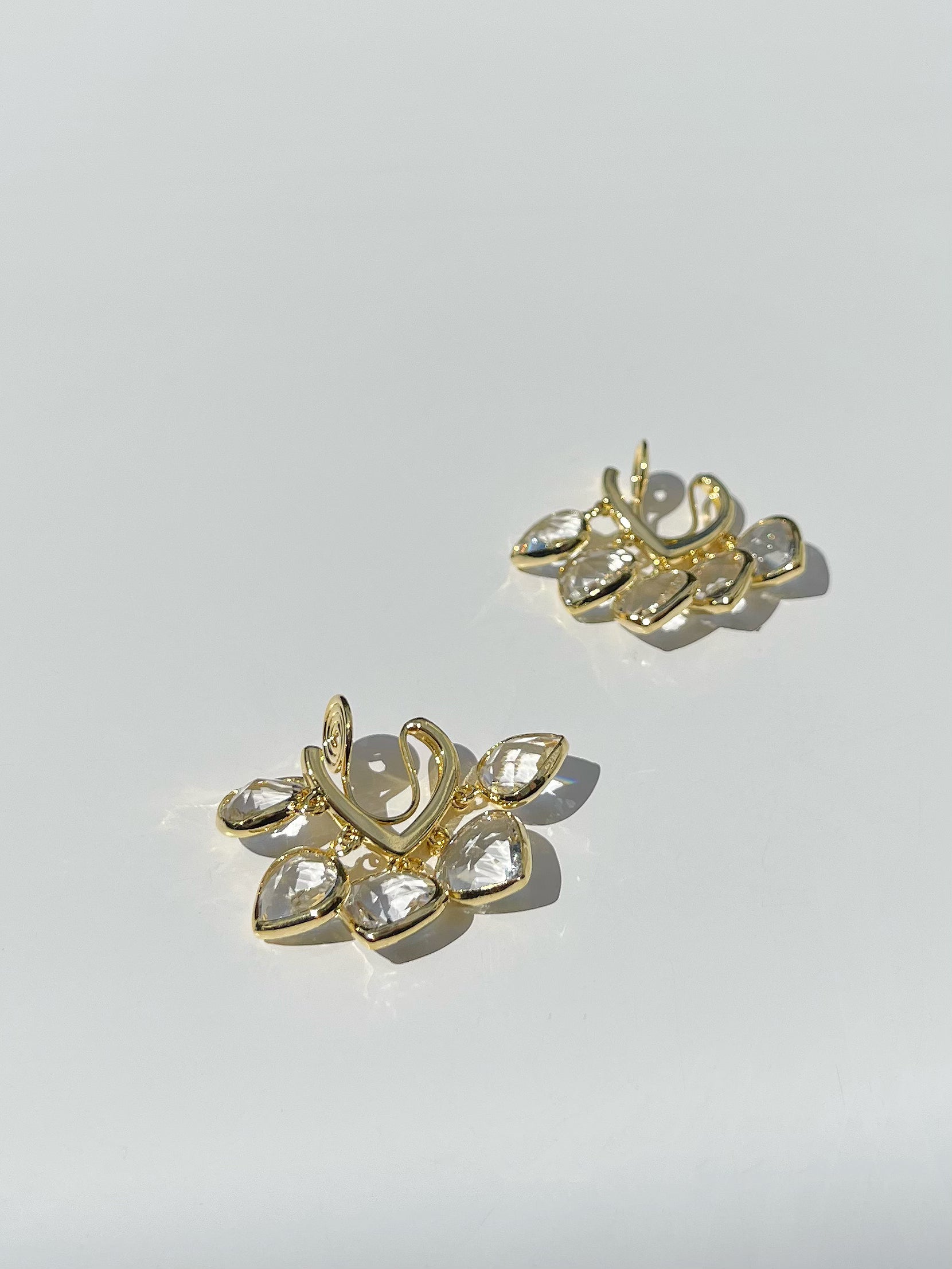 Golden Crystal Hearts Clip On Earrings. gold-tone clip-on earrings for women.