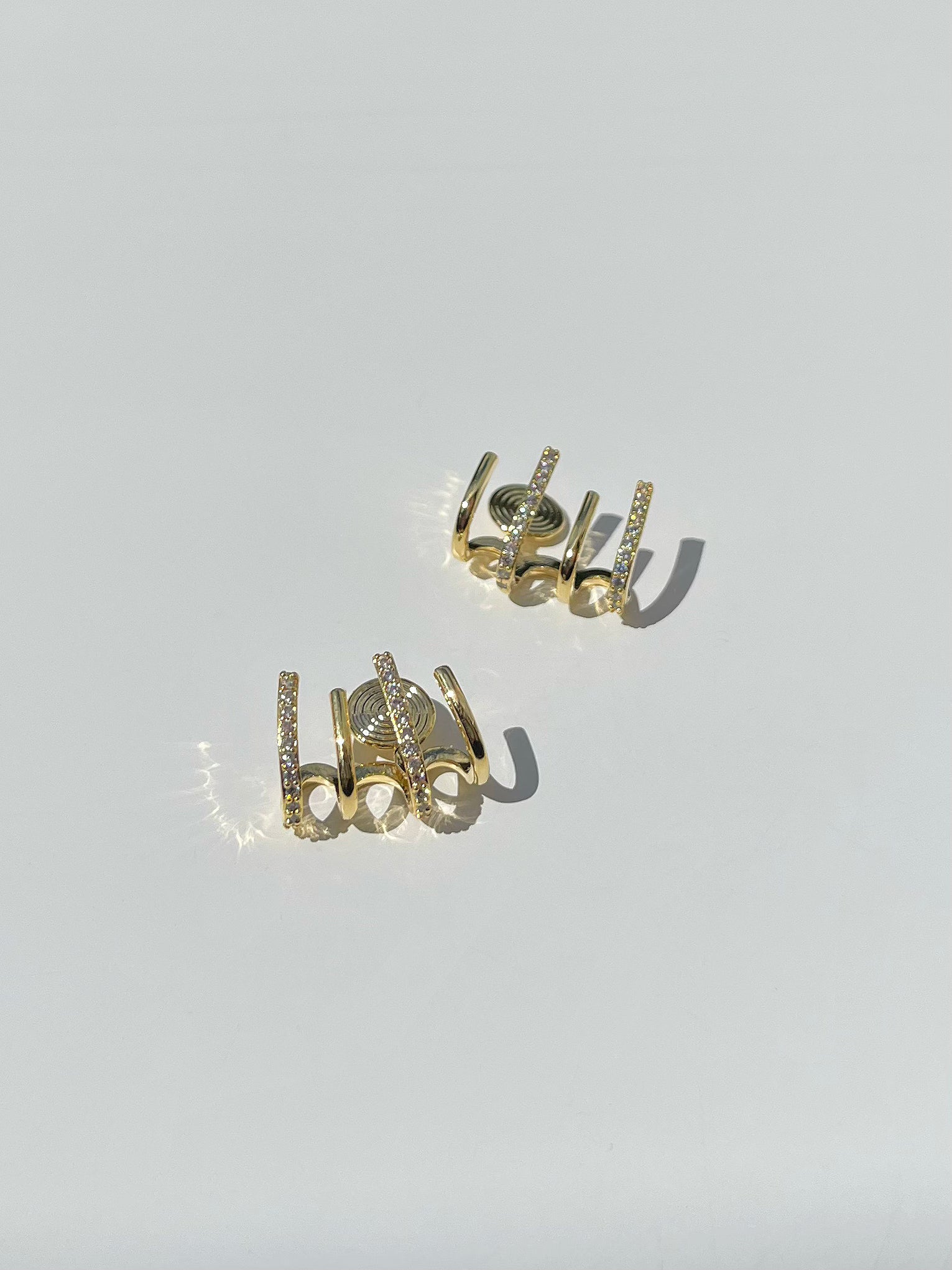 Golden Diamante Curve Clip On Earrings. gold-tone clip-on earrings for women.