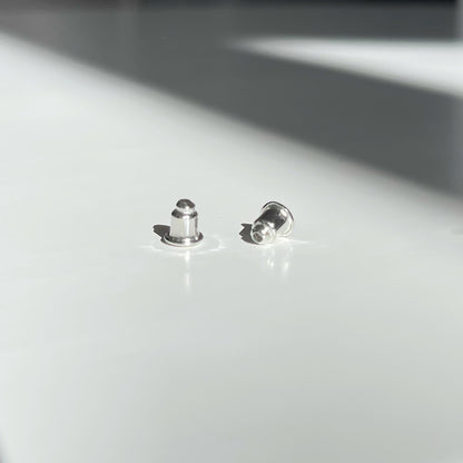 Gloss Silver Metal Earring Backs. silver-tone clip-on earrings for women.