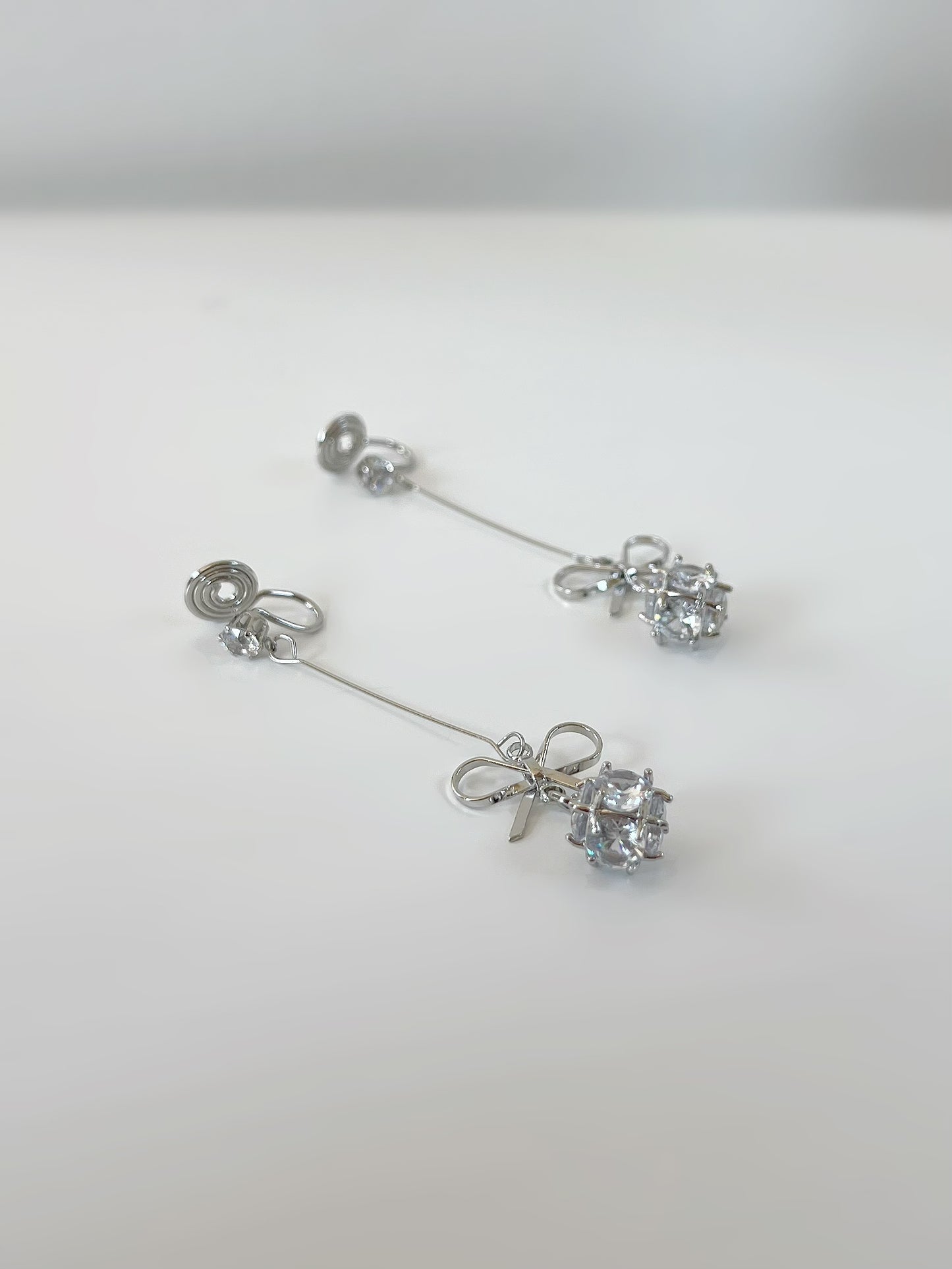 Silver Bow Zircon Long Drop Clip On Earrings