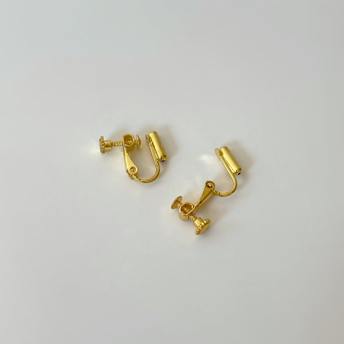 Golden Clip On Stud Earrings Converters. gold-tone clip-on earrings for women.