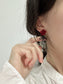 Flocking Red Flower Black Bow Clip On Earrings